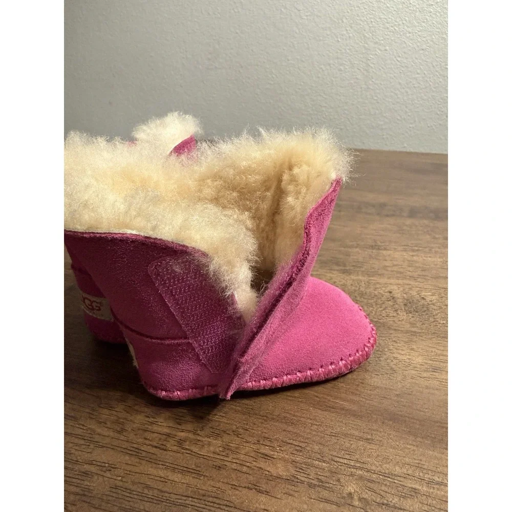 UGG Caden baby booties in fuchsia pink suede with sheepskin lining 0/1